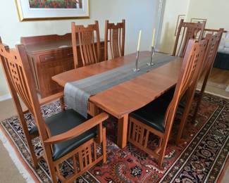 Fine Amish made Craftsman -style cherry wood dining room table with (6) chairs and two leaves.