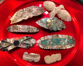 Great assortment of silver and abalone with mother of pearl and turquoise berets and hair clips.