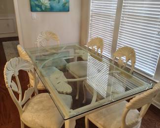 Awesome glass table with wood accents and matching chairs.