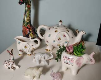 Assorted elephants and giraffes.