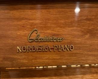 Nordiska Classica upright piano that has a gorgeous patina, and a very narrow body, which is perfect for many spaces