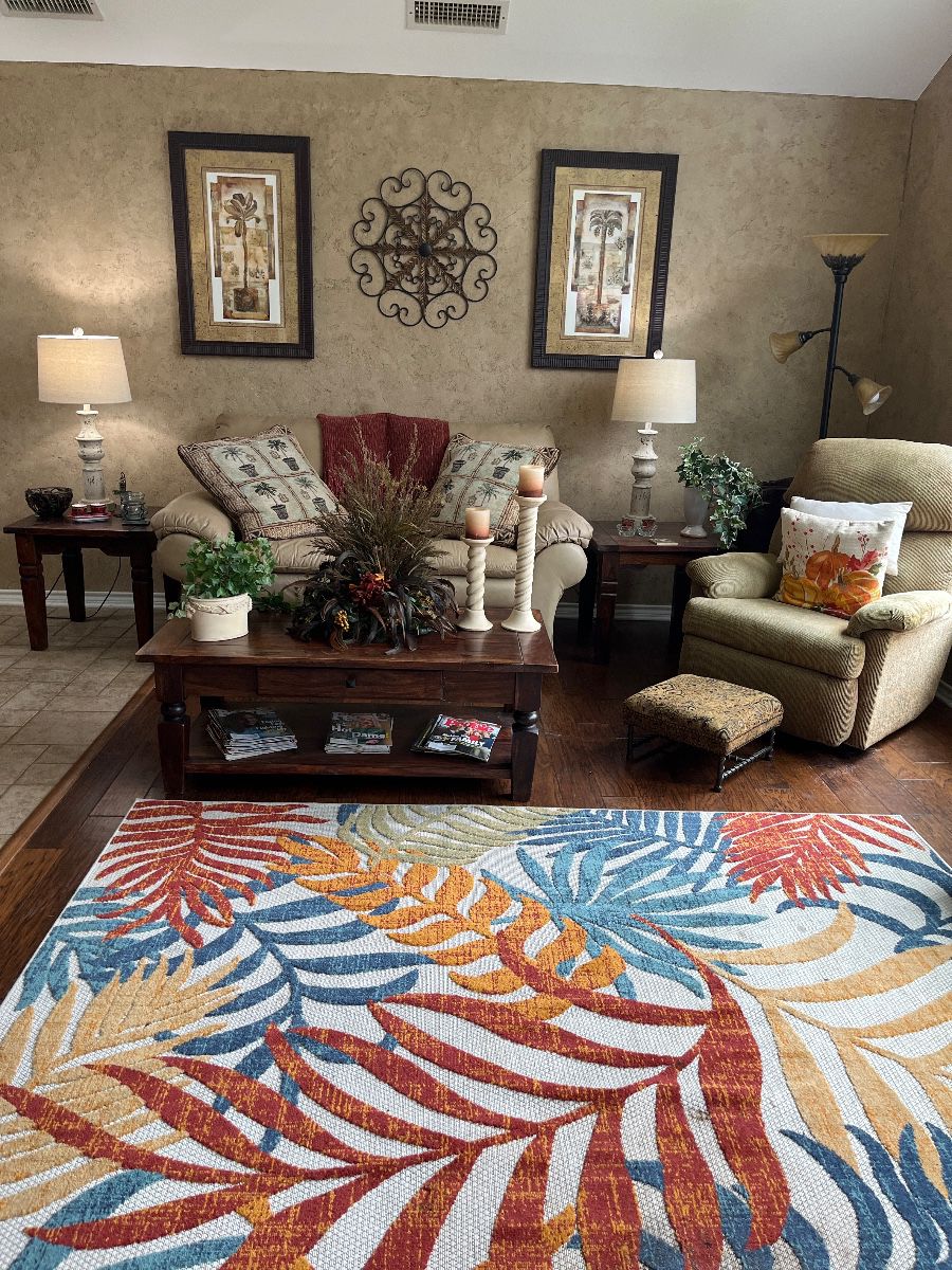 Leather Love Seat, Recliner, End Tables, Coffee Table,Lamps and Rug