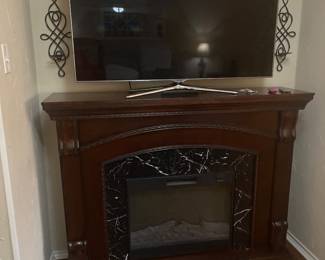 Electric Fireplace and Large Samsung Flatscreen TV