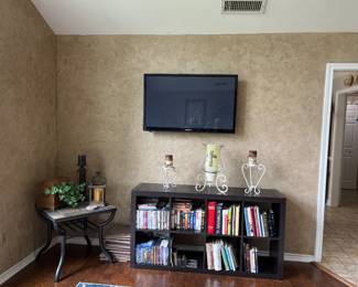 Bookcase, Slate Top End Table , Samsung TV, Books & Wrought Iron Decor