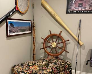 Large ship wheel, harpoon, large, tennis racket, and Louisville slugger bat