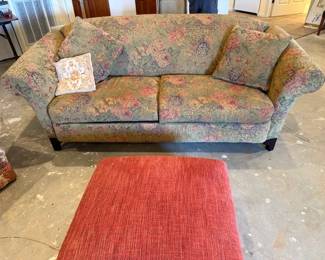 camelback sofa covered in tapestry