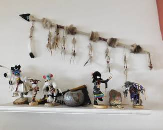 Obsidian spear with faux eagle feathers and several Kachinas