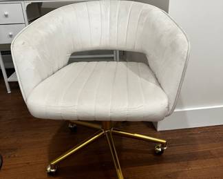 White chair with fabric suede-like material, on rollers, was $125, now $40
