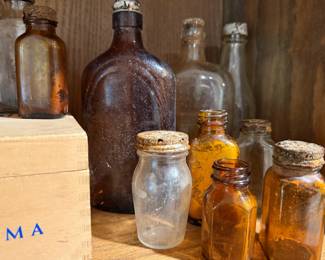 Assortment of Antique Amber and Clear Glass Apothecary Bottles