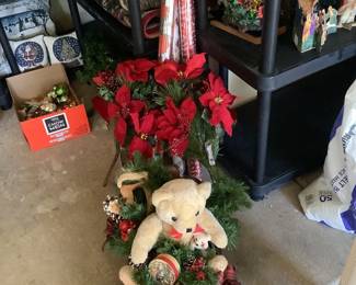 Christmas sled with Teddy bear, holiday wrapping paper and pinsettias