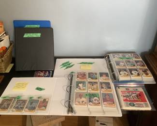 Four binder containing baseball and hockey cards.  Hockey cards are from the 70’s