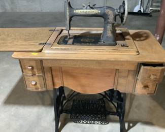 New home sewing machine in really nice cabinet.