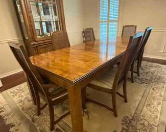 Dining Table and 6 Caned Back Chairs incudes 2 leaves and table pad protectors in amazing condition.