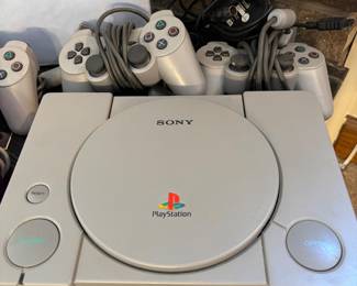 Playstation with controllers and games