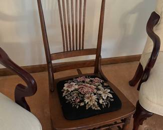 Antique rocking chair with needlepoint seat