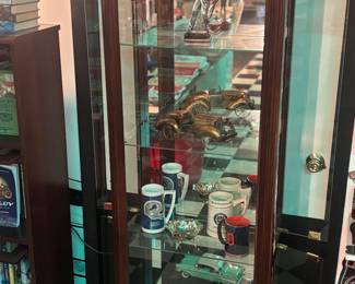 Lighted display cabinet, golf statue, model cars, Detroit Lions and Tigers mugs