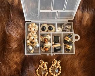 Fashion accessories include vintage scarves, select clothing pieces, jewelry and earrings..