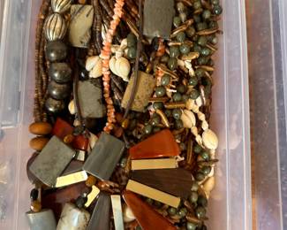 Fashion accessories include vintage scarves, select clothing pieces, and decorative accessories.