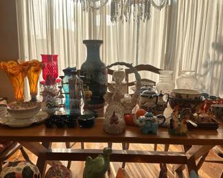 Additional notable items include antique clocks, decorative mirrors, framed artwork, carved tables, porcelain sets, vintage glassware, and unique sculptural decor pieces.
