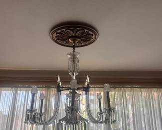 Lighting includes several striking chandeliers, vintage table lamps, and decorative lighting fixtures ranging from ornate bronze and crystal styles to unique statement pieces.