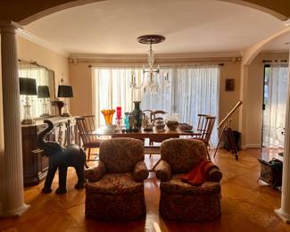 Furniture highlights include antique and vintage pieces such as serpentine front chests with marble tops, carved wood side tables, chinoiserie style tables and planters, dining chairs, upholstered lounge chairs, and additional traditional and European-inspired furnishings.