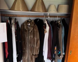 Fur coat, woman’s jackets and lamp shades.
