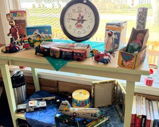 Vintage tin toys and clock.