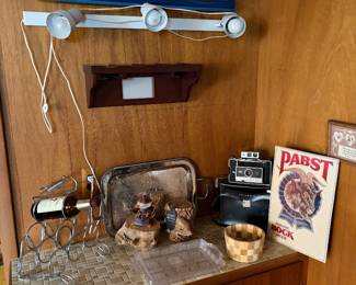 Vintage Genesee and Pabst bock beer signs, wine rack , vintage Polaroid camera, tray and more.