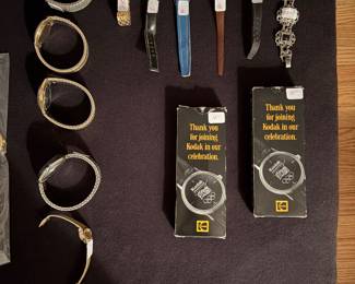 Vintage Kodak celebration watches, vintage $6 million man and Mickey Mouse watches men’s wrist watches 14 karat gold plated cross, pen, set, camp good days logo watch, women’s Seiko in variety of men’s wrist watches.