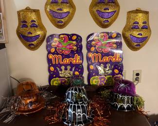 Mardi Gras costumes and posters and Halloween hats.