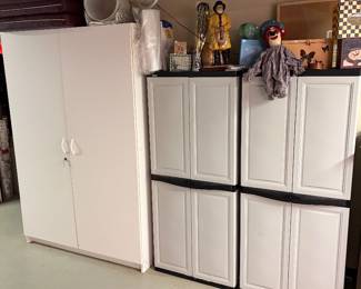 A pair of Rubbermaid  4 door storage closets, one of 4 fiberboard storage cabinets, dolls and gift boxes.