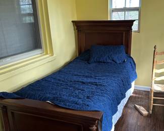 Twin beds come with next to new bedding
