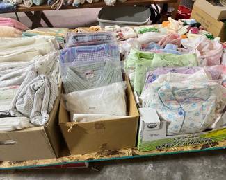 Lots of unopened vintage cotton blouses and flannel pajamas