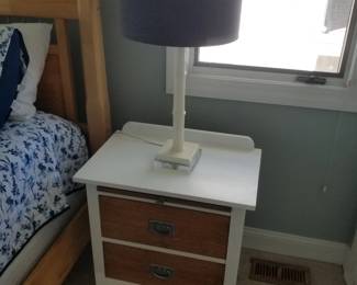 Two-drawer nightstand; table lamp