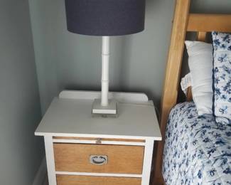 Two-drawer nightstand; table lamp