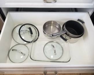 Cabinets have drawers; pots & pans