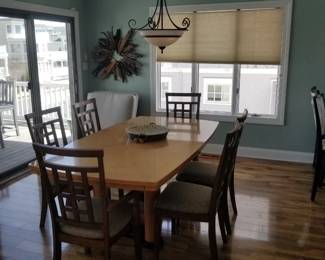 Elegant dining table seats 6; includes two extra leaves (not shown)