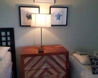 3-drawer dresser; table lamp