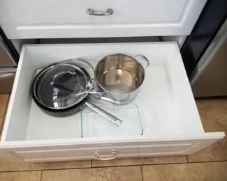 Cabinets have drawers; pots & pans