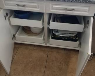 Cabinets have pull out shelves