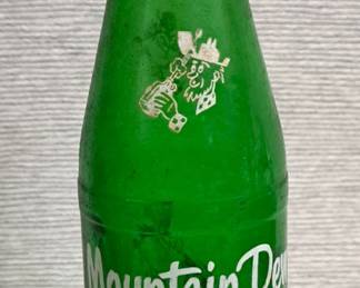 MOUNTAIN DEW BOTTLE WITH WRITING BY WORKERS