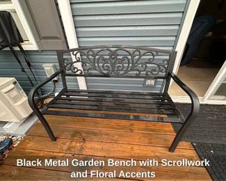 Black Metal Garden Bench with Scrollwork and Floral Accents