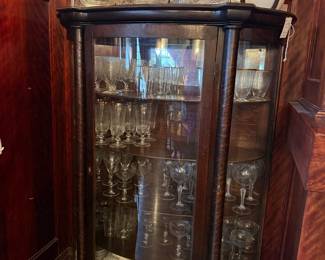 Antique Tiger Oak Curved Glass China Cabinet with Claw Feet and Assorted Glassware