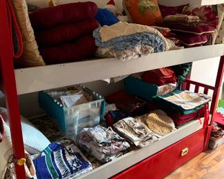 Vintage Linens and Pillows Assortment on Daybed