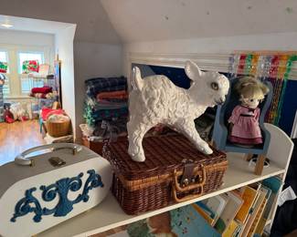 White Ceramic Lamb Figurine on Wicker Picnic Basket