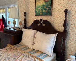 Dark Wood Four-Poster Bed with Ornate Headboard