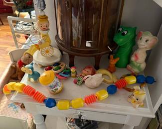 Vintage Children's Toy Assortment: Rubber Toys, Wooden Clown, and Snap Beads