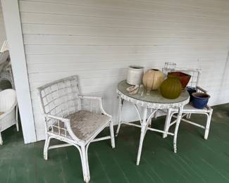 White Rattan Dining Chairs with Table and Vases