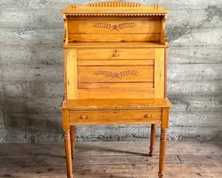 This lot features a plantation-style secretary desk with intricate details throughout that measures, 60.5” H x 36” W x 20.5” D.