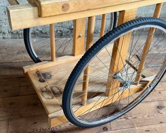 A whimsically designed Chopping Block Bar Cart by the noted California designer Bill W. Sanders. This design dates to the 1960’s. The bicycle tires may have been replaced at some point. The butcher block is in good condition. The bicycle wheels are a little wobbly when wheeled around but the cart is stable and sturdy. This cart measures, 29.5” H x 22” W x 34” D. A similar example is pictured in the book by the Pasadena Art Museum, California Design/Nine, Pasadena, 1965, Page 112.